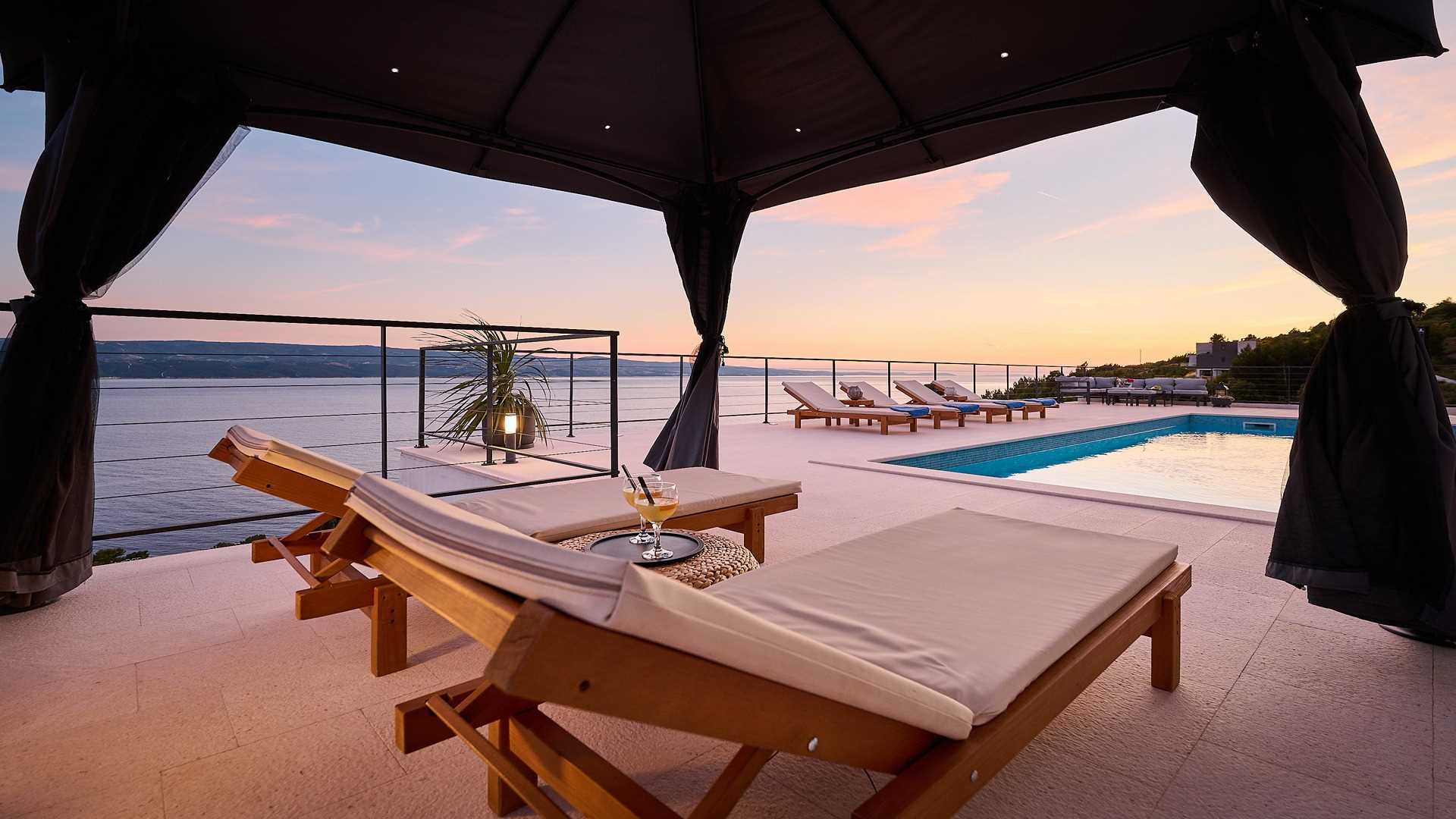A modern villa with a pool and an amazing sea view