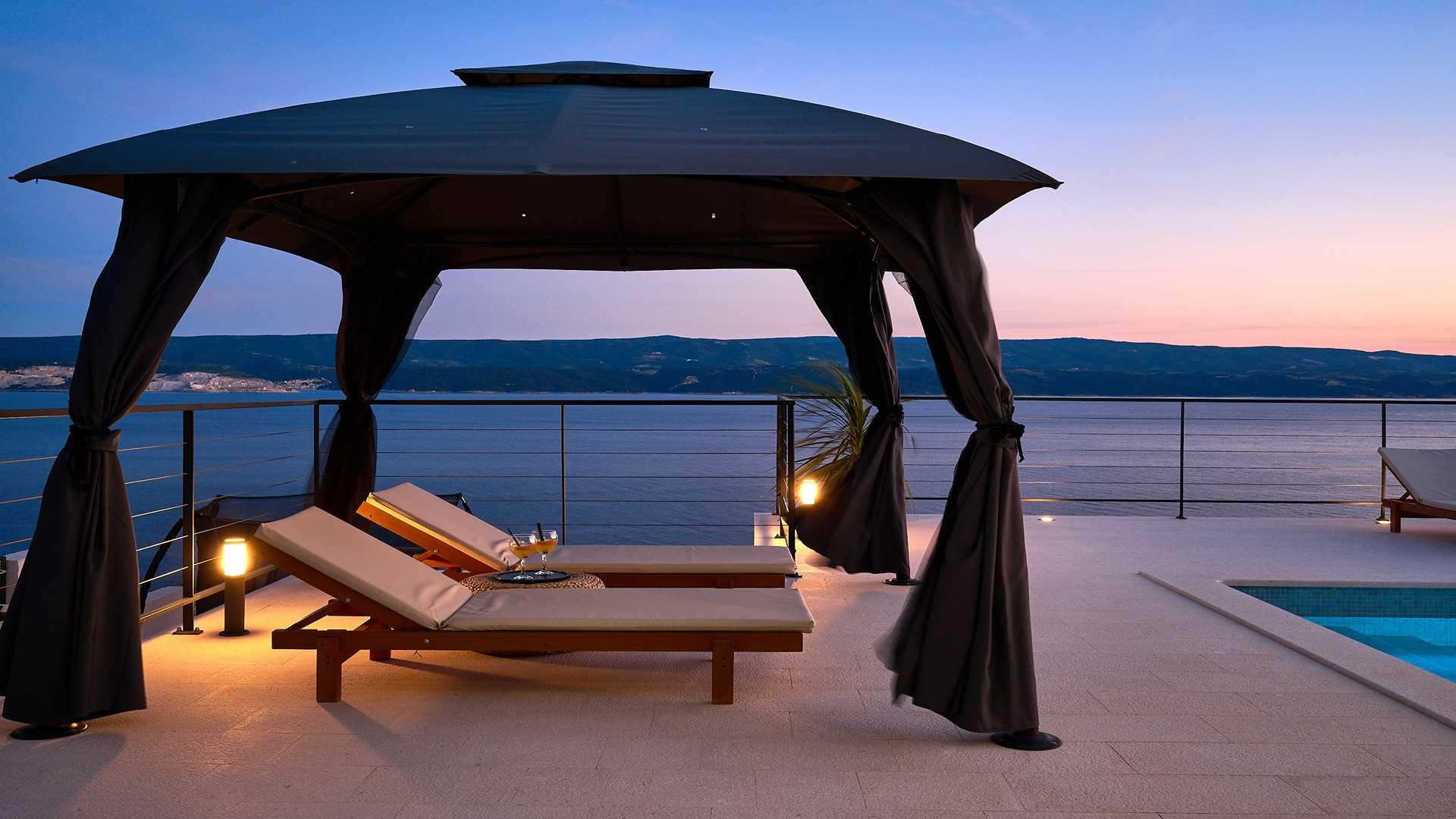 A modern villa with a pool and an amazing sea view