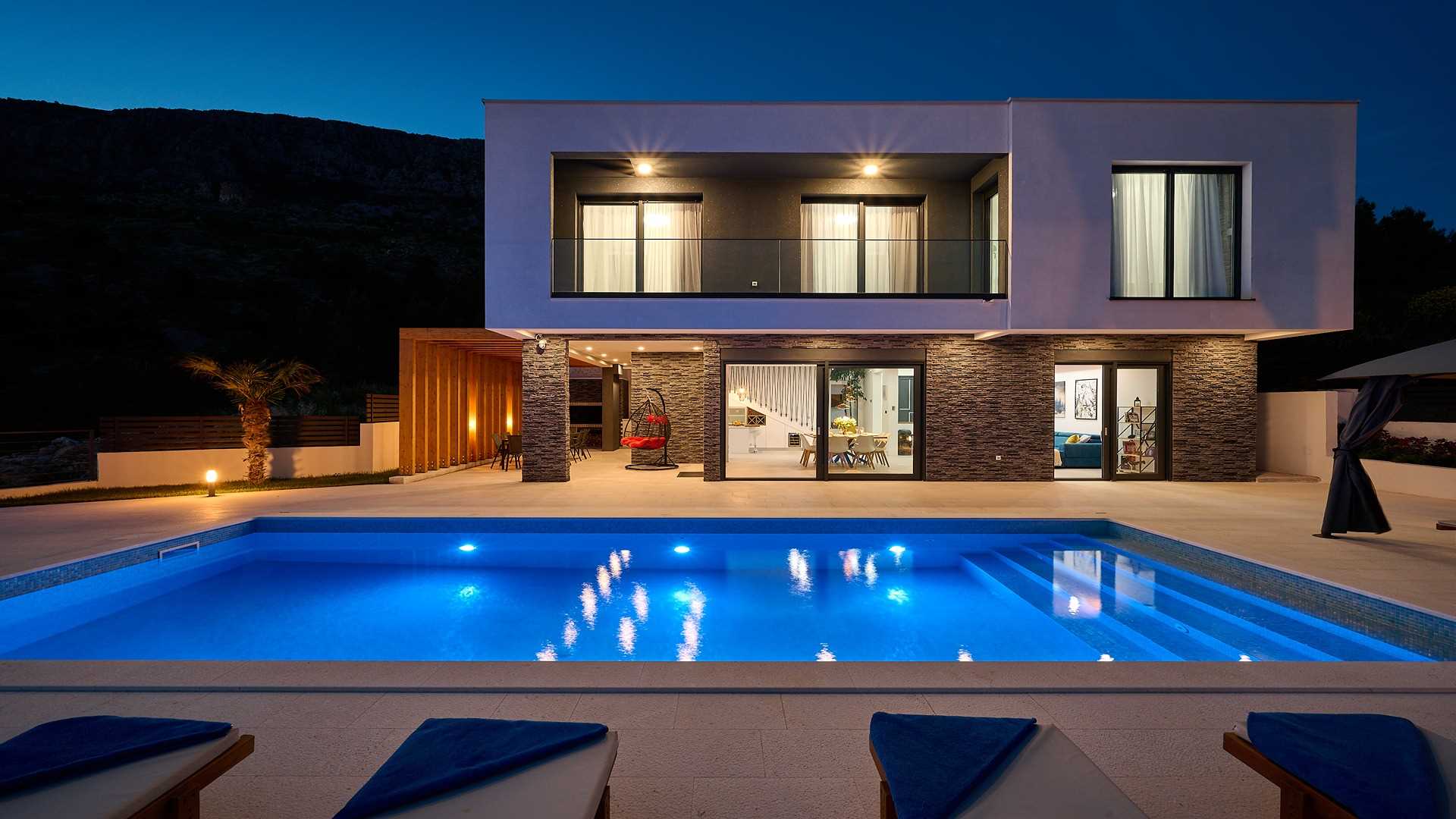 A modern villa with a pool and an amazing sea view