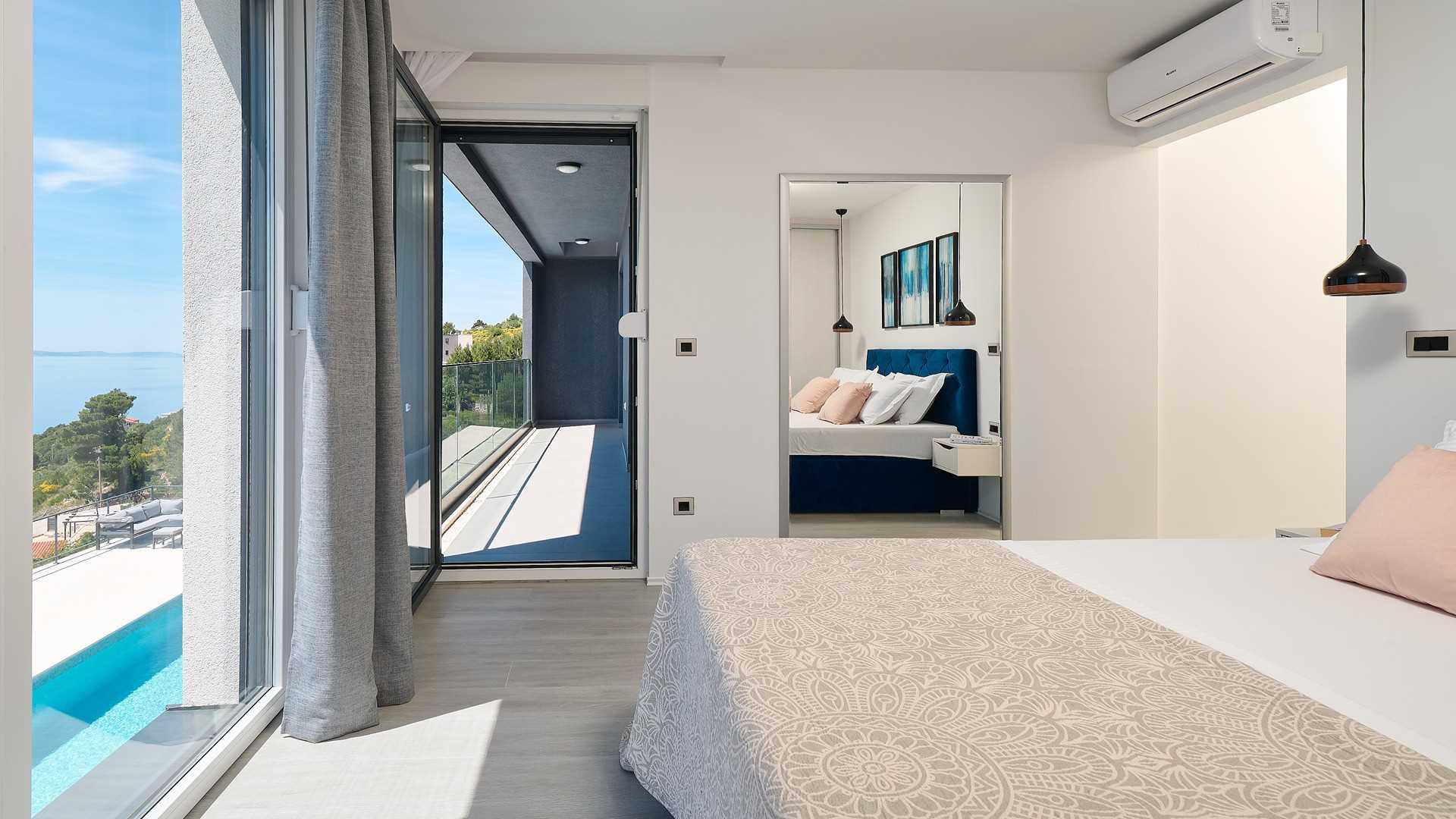 A modern villa with a pool and an amazing sea view