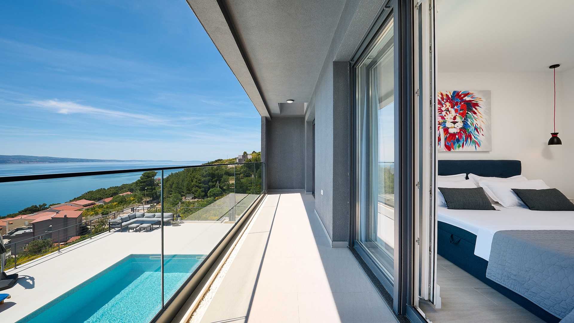 A modern villa with a pool and an amazing sea view
