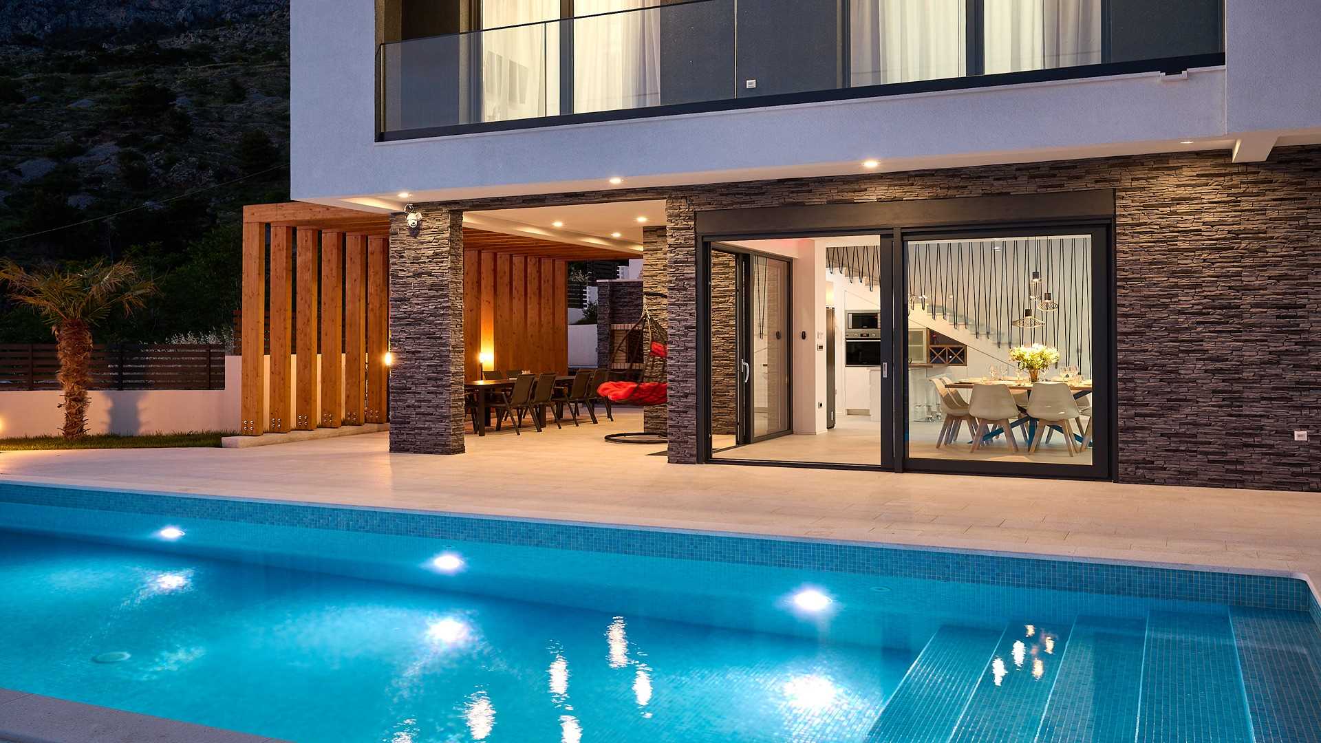 A modern villa with a pool and an amazing sea view