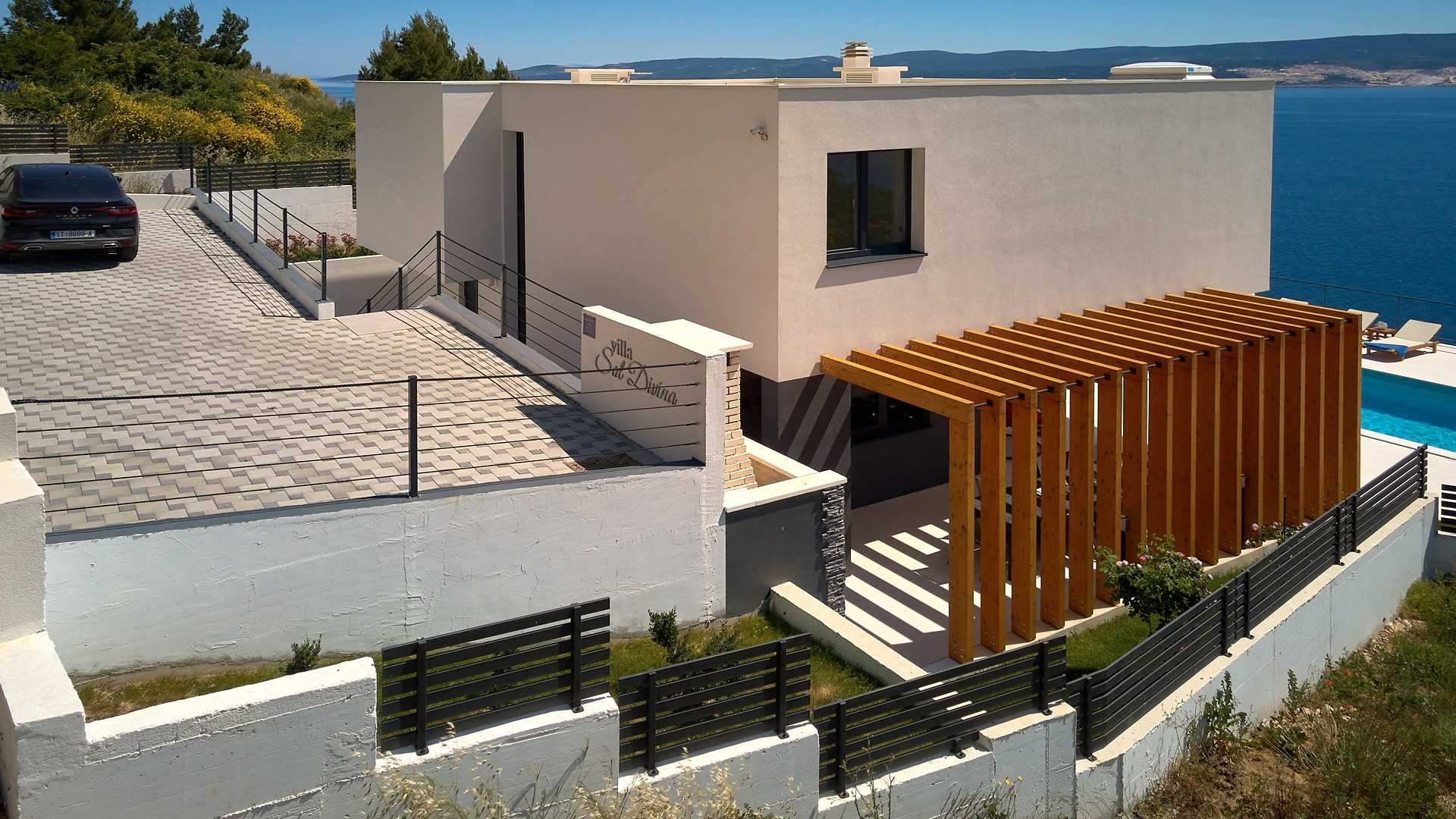 A modern villa with a pool and an amazing sea view