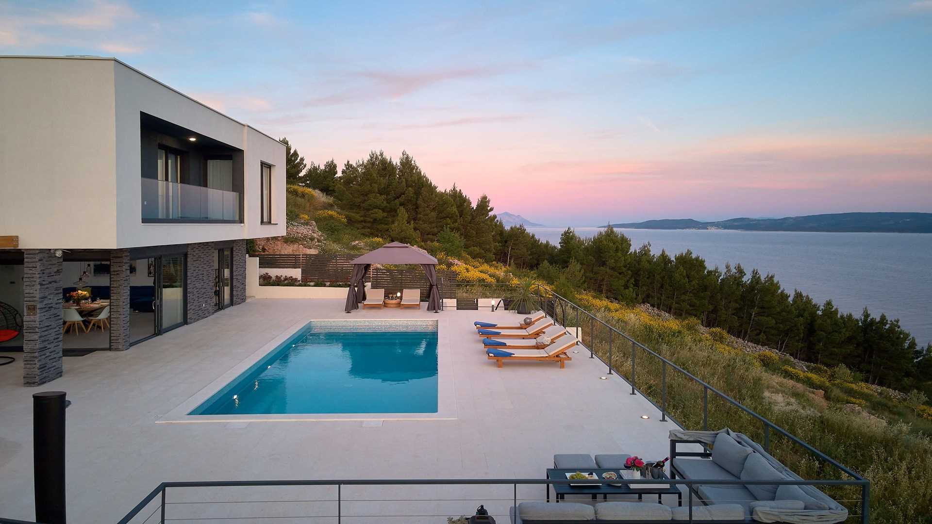 A modern villa with a pool and an amazing sea view